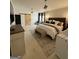 Elegant main bedroom with a modern barn door, accent wall, and plush furnishings at 125 Sir Lancelot Ct, Fayetteville, GA 30214