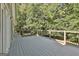 Expansive deck perfect for entertaining with beautiful views of the surrounding trees at 118 Whitfield Run, Peachtree City, GA 30269