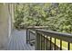 Spacious back deck with black metal railing and an outdoor space to relax at 118 Whitfield Run, Peachtree City, GA 30269