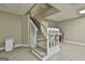 Finished basement stairs with neutral carpet and bright white risers and banister at 118 Whitfield Run, Peachtree City, GA 30269