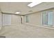 Finished basement with carpet, white trim and large windows at 118 Whitfield Run, Peachtree City, GA 30269