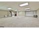 Finished basement with neutral carpet, built in shelving, and stairs at 118 Whitfield Run, Peachtree City, GA 30269