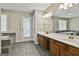 This bathroom features a double vanity and a soaking tub with tiled surround at 118 Whitfield Run, Peachtree City, GA 30269