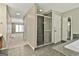 This bathroom features a glass enclosed shower with view into the main bedroom at 118 Whitfield Run, Peachtree City, GA 30269