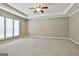 Spacious bedroom with carpet flooring, tray ceiling, and large windows, offering a bright and airy feel at 118 Whitfield Run, Peachtree City, GA 30269