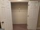 Spacious walk-in closet has double doors and ample storage with multiple shelving units at 118 Whitfield Run, Peachtree City, GA 30269