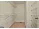 Walk-in closet offers ample storage with multiple shelving units for organization at 118 Whitfield Run, Peachtree City, GA 30269
