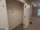 Walk-in closet with lots of storage space and shelving is located off the main bedroom at 118 Whitfield Run, Peachtree City, GA 30269