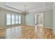 This dining room features hardwood floors, a trey ceiling, and lots of natural light at 118 Whitfield Run, Peachtree City, GA 30269