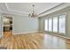 This dining room features hardwood floors, a trey ceiling, and lots of natural light at 118 Whitfield Run, Peachtree City, GA 30269