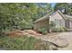 Home exterior featuring flagstone walkway, mature landscaping, and beautiful architectural details at 118 Whitfield Run, Peachtree City, GA 30269