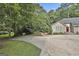 A charming home with lush landscaping, a spacious driveway, and inviting curb appeal at 118 Whitfield Run, Peachtree City, GA 30269