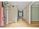 Inviting foyer with hardwood floors, neutral walls, and a view into the living space, creating a warm welcome at 118 Whitfield Run, Peachtree City, GA 30269