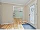 Home foyer with beautiful hardwood floors and a view into the dining room at 118 Whitfield Run, Peachtree City, GA 30269