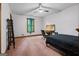 Bedroom with an office space featuring desk, chair, and natural light from the window at 1290 Shadowlawn Ne Dr, Conyers, GA 30012
