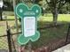 A green and secure dog park, with rules posted, providing a safe and fun environment for dogs and their owners at 1290 Shadowlawn Ne Dr, Conyers, GA 30012