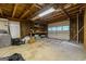Spacious garage with storage shelves and a white overhead garage door at 1290 Shadowlawn Ne Dr, Conyers, GA 30012