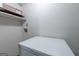 Small laundry area featuring a freezer, storage shelf and hook ups at 1290 Shadowlawn Ne Dr, Conyers, GA 30012