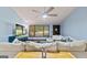 Bright living room features a ceiling fan, and a comfortable sectional sofa with stylish decor at 1290 Shadowlawn Ne Dr, Conyers, GA 30012