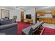Living room featuring a sofa, entertainment center and view into the kitchen at 1290 Shadowlawn Ne Dr, Conyers, GA 30012