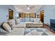 Comfortable living room features hardwood floors, a sectional sofa, and neutral tones for a relaxing atmosphere at 1290 Shadowlawn Ne Dr, Conyers, GA 30012