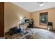 Home office setup with a computer desk, comfortable chair, and natural light from a window at 1290 Shadowlawn Ne Dr, Conyers, GA 30012