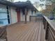Spacious deck with wood railing, brick house exterior and outdoor living space at 655 Shellnut Dr, Forest Park, GA 30297