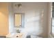 Bright bathroom with modern fixtures, a large mirror, and clean, neutral finishes at 655 Shellnut Dr, Forest Park, GA 30297