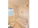 Bright bathroom features tile surround, modern fixtures and natural light from window at 655 Shellnut Dr, Forest Park, GA 30297