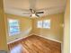 Bright bedroom with hardwood floors, ceiling fan, and natural light from multiple windows at 655 Shellnut Dr, Forest Park, GA 30297