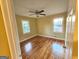 Bedroom with hardwood floors, ceiling fan and natural light from the windows at 655 Shellnut Dr, Forest Park, GA 30297