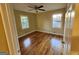 Well-lit bedroom with hardwood floors, large windows, and natural light at 655 Shellnut Dr, Forest Park, GA 30297
