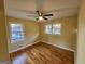 Bedroom features hardwood floors, neutral walls, and multiple windows providing natural light at 655 Shellnut Dr, Forest Park, GA 30297