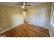 Cozy bedroom with hardwood floors, closet, ceiling fan, and plenty of natural light at 655 Shellnut Dr, Forest Park, GA 30297