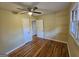 Inviting bedroom with hardwood floors, ceiling fan, and natural light from the window at 655 Shellnut Dr, Forest Park, GA 30297