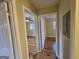 Hallway view showcasing hardwood floors and doorways to bedrooms and other living spaces at 655 Shellnut Dr, Forest Park, GA 30297