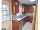 Modern kitchen with dark cabinets, stainless steel appliances, and stone countertops at 655 Shellnut Dr, Forest Park, GA 30297