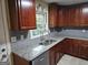 Kitchen features granite countertops, stainless steel appliances, and ample cabinet space at 655 Shellnut Dr, Forest Park, GA 30297