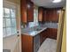 Updated kitchen features granite countertops, stainless steel appliances, and wooden cabinetry at 655 Shellnut Dr, Forest Park, GA 30297