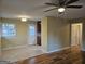 Bright living room features hardwood floors, natural light, and an open concept view to the kitchen at 655 Shellnut Dr, Forest Park, GA 30297