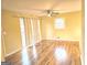 Inviting living room with hardwood floors, large windows, and curtains at 655 Shellnut Dr, Forest Park, GA 30297