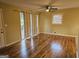 Sunlit living room features gleaming hardwood floors, neutral walls, and natural light at 655 Shellnut Dr, Forest Park, GA 30297