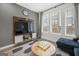 Comfortable living room featuring modern decor, a large TV, and plenty of natural light at 383 Pratt Dr # 506, Atlanta, GA 30315