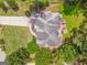 Aerial view of a landscaped backyard with a deck, a home and well manicured lawns at 119 Creekside Vw, Hiram, GA 30141