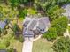 Aerial view of a landscaped backyard with a deck, a home and well manicured lawns at 119 Creekside Vw, Hiram, GA 30141