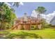 Beautiful backyard showcasing a two-story deck and well-maintained lawn with surrounding greenery at 119 Creekside Vw, Hiram, GA 30141