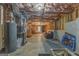 Unfinished basement space with exposed ceiling, water heater, and ample potential at 119 Creekside Vw, Hiram, GA 30141
