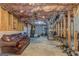 Unfinished basement area with exposed beams, ductwork, and a workout space at 119 Creekside Vw, Hiram, GA 30141