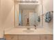Bathroom featuring a large mirror, vanity, and a view into the next room at 119 Creekside Vw, Hiram, GA 30141