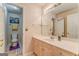 Neutral bathroom features a long countertop, vanity with cabinets, and a separate toilet at 119 Creekside Vw, Hiram, GA 30141